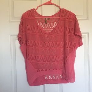 Coral shirt with pattern cut outs